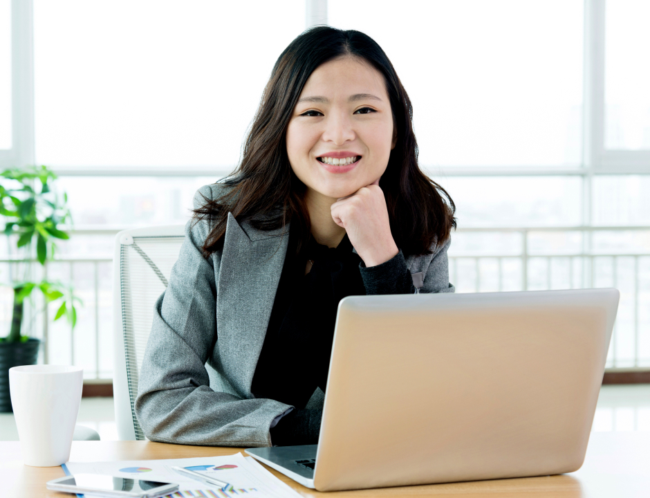 happy executive woman in her office