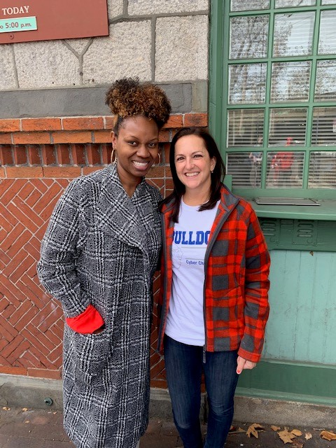 Two women smiling at the camera